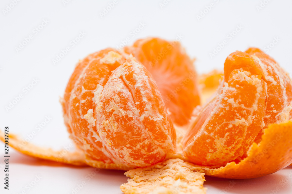 Peeled tangerine or mandarin orange isolated on white background Peeled tangerine or mandarin orange isolated on white background