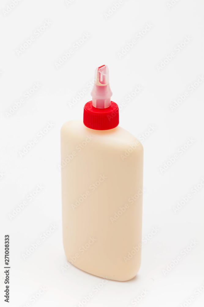 Wood Glue Bottle with Spreader Cap on a white background Wood Glue Bottle with Spreader Cap on a white background