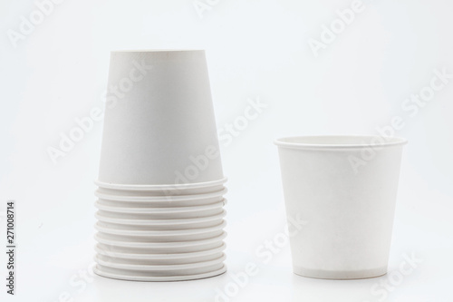 White paper cup and cups on white backbround