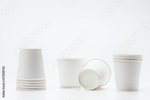 White paper cup and cups on white backbround