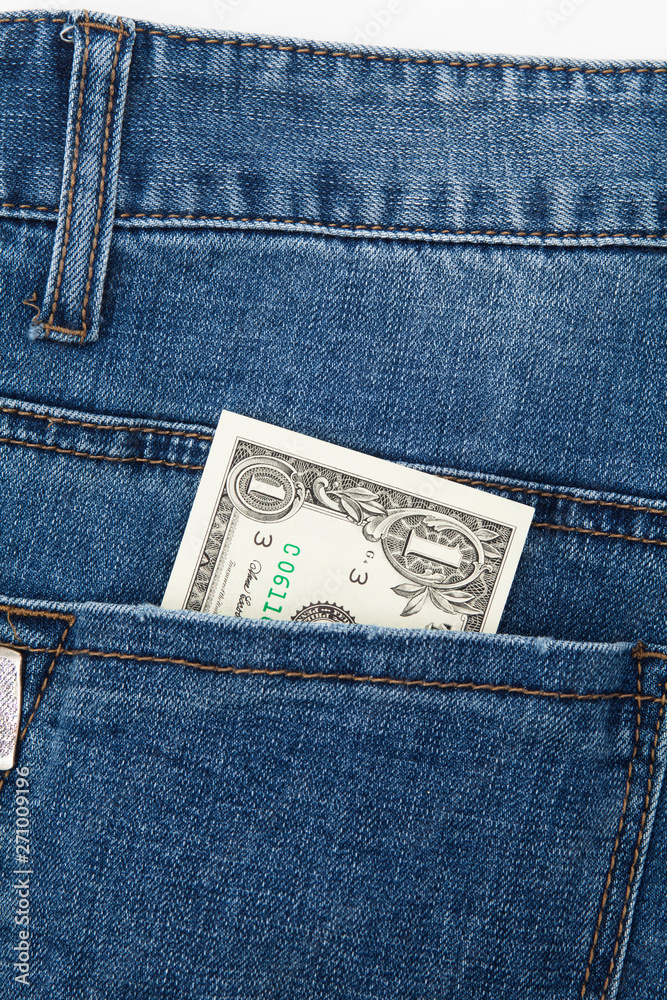 One dollar bill in the back pocket of blue jeans One dollar bill in the back pocket of blue jeans