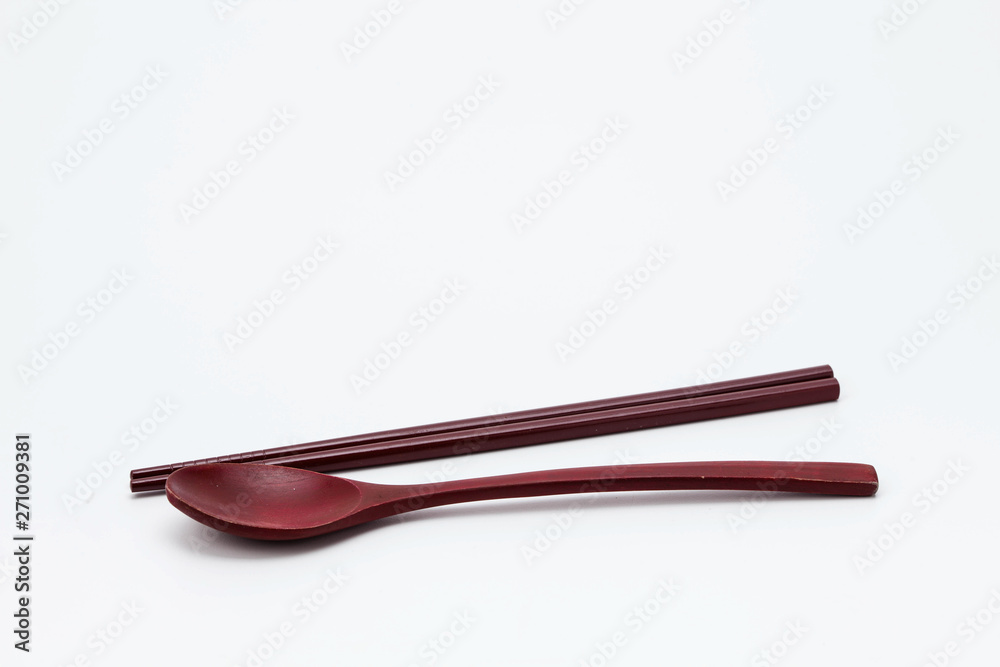 Wooden chopsticks and spoon isolated on white background Wooden chopsticks and spoon isolated on white background