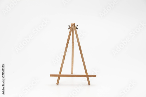 Small wooden easel on a white background