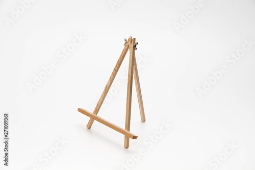 Small wooden easel on a white background
