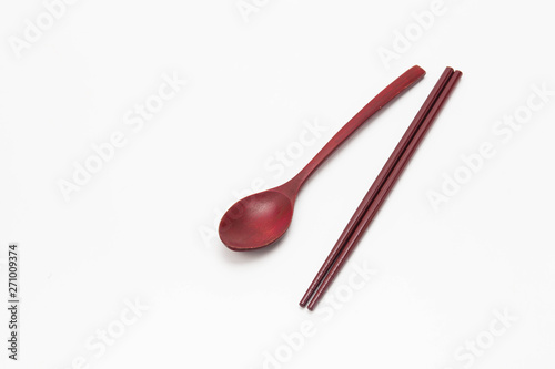 Wooden chopsticks and spoon isolated on white background
