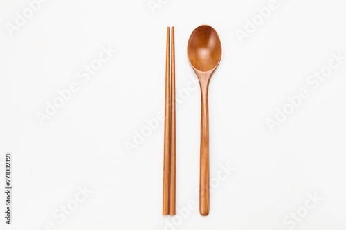 Wooden chopsticks and spoon isolated on white