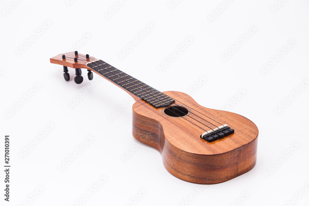The ukulele guitar isolated on white The ukulele guitar isolated on white