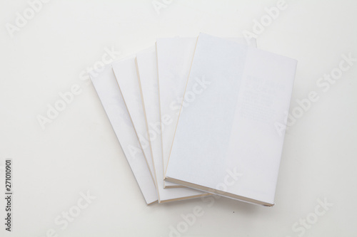 Stack of books on white background