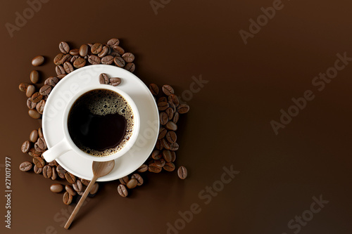 Coffee cup with beans on dark brown background. 3d rendering 