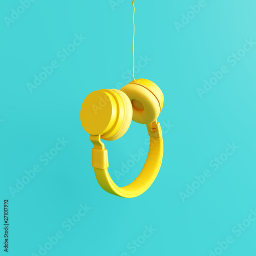 Yellow headphone with pastel blue background. 3d rendering