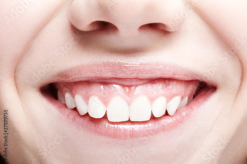 Woman with pink lips and healthy dentes.Girl is smiling. photo