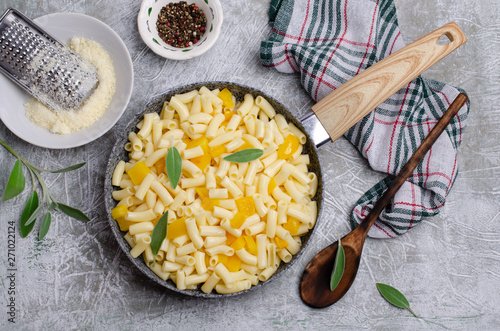 Pasta with slices of yellow pepper photo