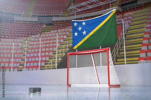 Flag of Solomon Islands in hockey arena with puck and net