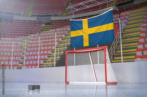 Flag of Sweden in hockey arena with puck and net
