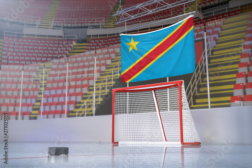 Flag of Democratic Republic of the Congo in hockey arena with puck and net