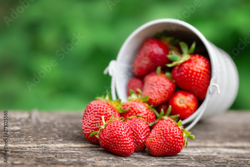 ripe strawberries on wooden table