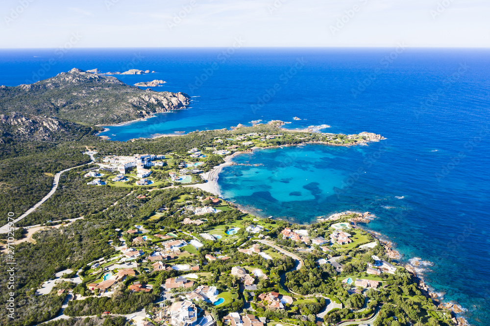 View from above, stunning aerial view of the Romazzino Beach bathed by a beautiful turquoise sea. Costa Smeralda (Emerald Coast) Sardinia, Italy.