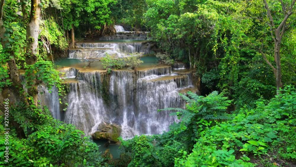 Waterfall flow standing with forest enviroment high angle view in thailand called Huay or Huai mae khamin in Kanchanaburi province, Thailand., Lockdown. Waterfall flow standing with forest enviroment high angle view in thailand called Huay or Huai mae khamin in Kanchanaburi province, Thailand., Lockdown.