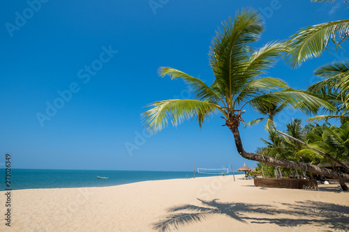 Fototapeta Naklejka Na Ścianę i Meble -  Beautiful tranquil scenery of tropical landscape sea view and palm tree on sand beach. Travel inspirational, Summer holiday and vacation concept for tourism relaxing.
