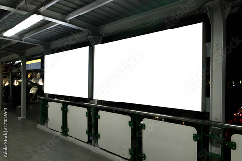 Two blank billboards situated at a train location. Blank horizontal big poster in public place.