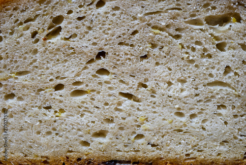 Traditional Transylvanian freshly baked bread, visible pieces of potato, image for background.