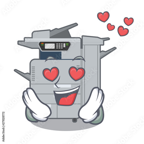 In love copier machine above mascot wood table