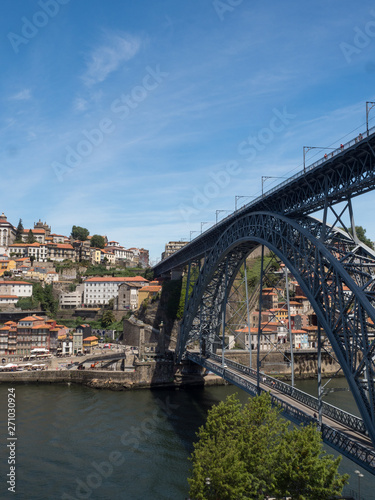 Scenic view of the Porto Old Town pier architecture and bridge Dom Luis over Duoro river in Porto, Portugal. May 2019