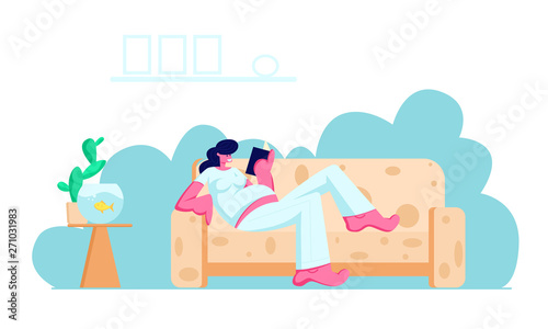 Young Pregnant Woman with Big Belly Lying on Comfortable Sofa Reading Book at Home