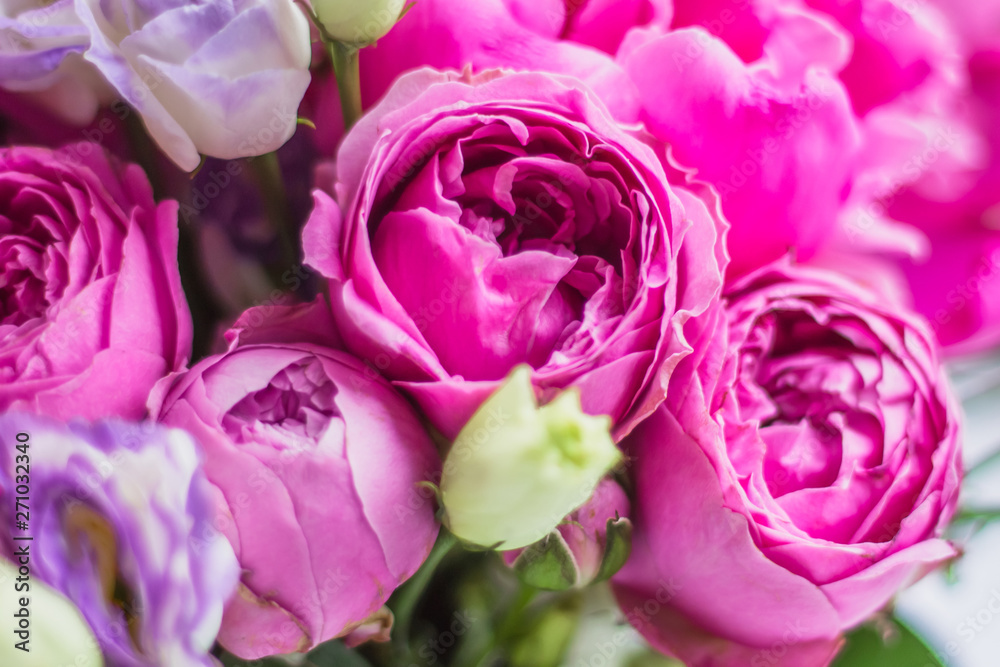 Texture background of flowers, peonies, roses. Arrangement of flowers in a hat box. Bouquet of peonies, eustoma, spray rose in a pink box with an oasis on a white background Texture background of flowers, peonies, roses. Arrangement of flowers in a hat box. Bouquet of peonies, eustoma, spray rose in a pink box with an oasis on a white background