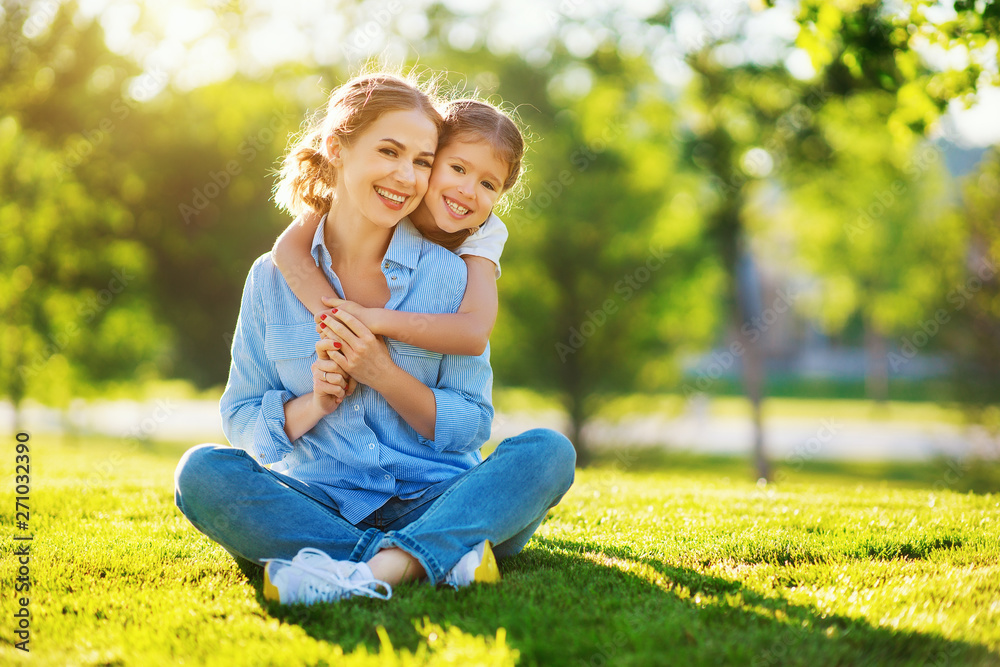 Fototapeta premium happy family mother and child daughter in nature in summer