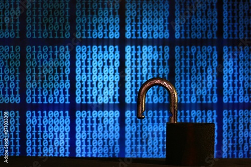 opened padlock in front of binary code blocks background. cyberspace computer security breached. internet hacker cyber war reached privacy data server. insecure internet connection. stealing data.