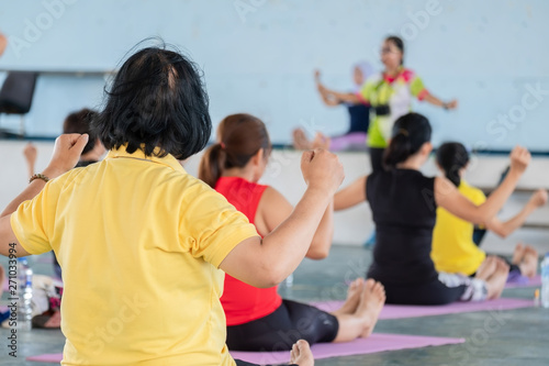 Elderly in a yoga exercise posture