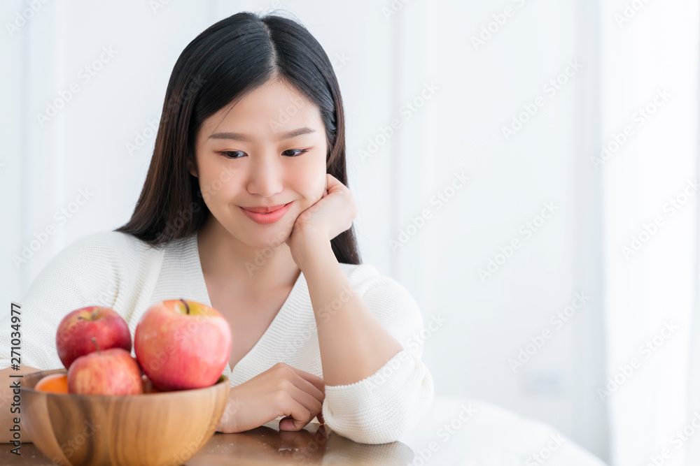 healthy pretty asian woman happiness enjoy eat and love diet with red fresh apple fruit weight loss iedeas concept white room interior background healthy pretty asian woman happiness enjoy eat and love diet with red fresh apple fruit weight loss iedeas concept white room interior background