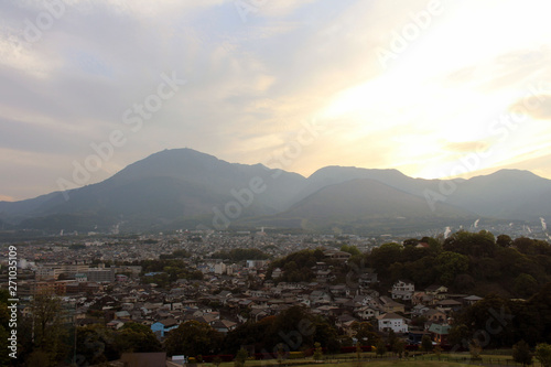 The landscape of Beppu in Oita and golf range as seen from a hill in sunset