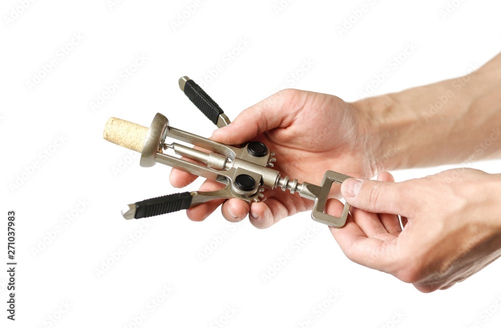 Hand holding a corkscrew. Close up. Isolated on white background Hand holding a corkscrew. Close up. Isolated on white background