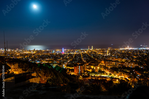 Barcelona skyline panorama at night from Turo Rovira, Catalonia, Spain.