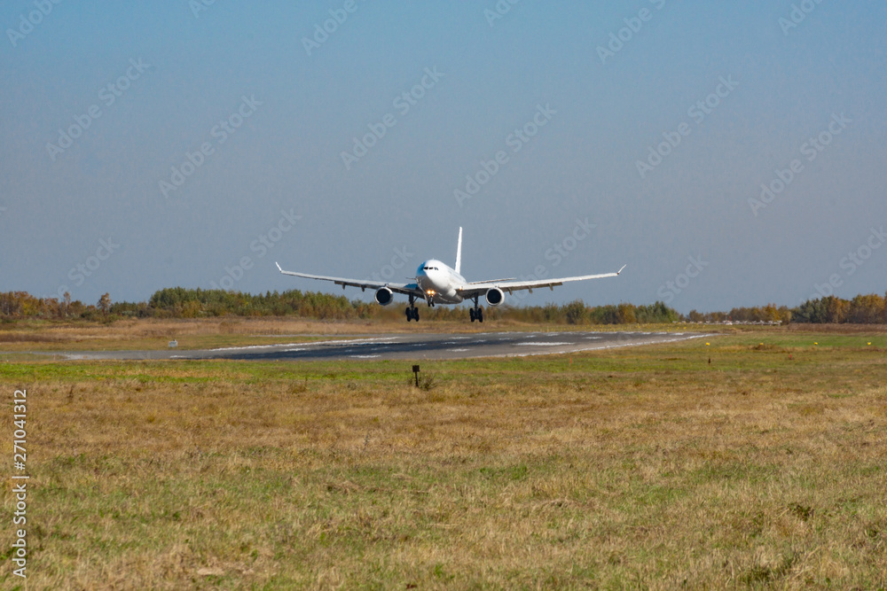 KHABAROVSK, RUSSIA - SEP 29, 2018: Airbus A330-200 VP-BUB Nordwind Airlines lands at the airport of Khabarovsk. KHABAROVSK, RUSSIA - SEP 29, 2018: Airbus A330-200 VP-BUB Nordwind Airlines lands at the airport of Khabarovsk.