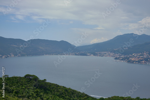 Two islands in the ocean, a Catholic temple on top of a mountain, blue sky, sunny day. © StockAleksey