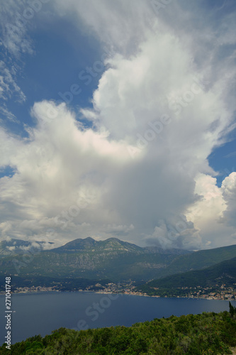 a large cloud over Petrovac, a blue sky on a bright sunny day, a cloud obscured the sun