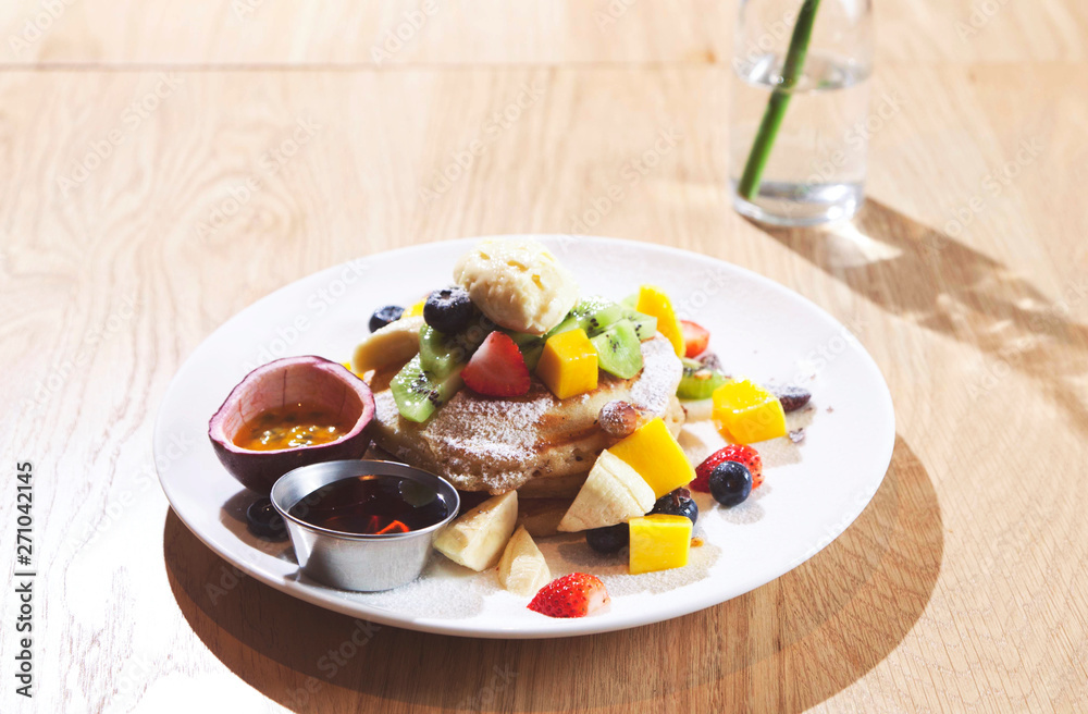 Breakfast composition with fresh pancakes and berries on wood background. Breakfast composition with fresh pancakes and berries on wood background.