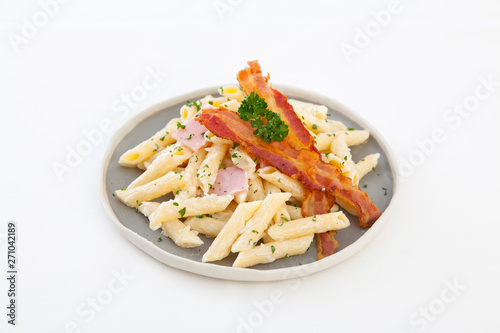 Italian Penne Pasta with Bacon on White Background