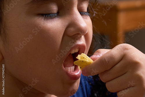 Girls sit and enjoy to eating snacks