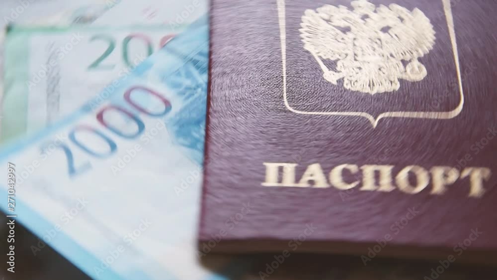 russian identification document on russian rubles money rotates around