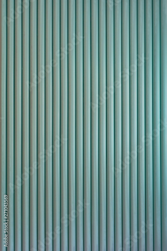 Striped background. Vertically structure of repeated green rolls