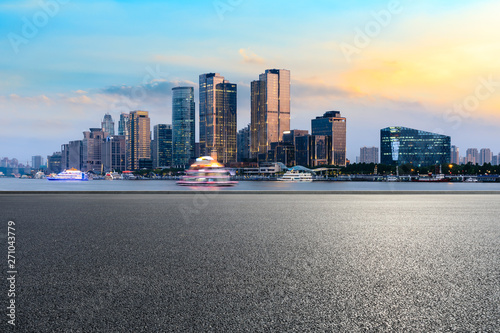 Shanghai city skyline and modern commercial office building with empty road at dusk © ABCDstock