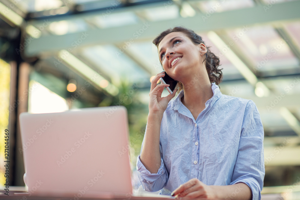 Candid image of a businesswoman working in a cafe. Selective focus. Candid image of a businesswoman working in a cafe. Selective focus.