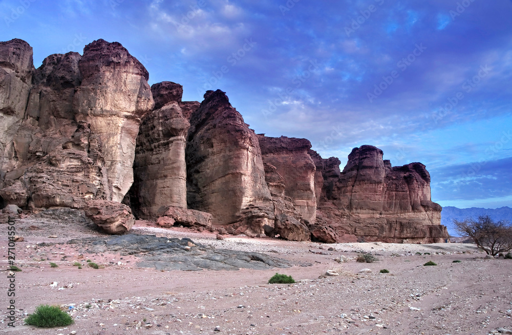 Jnique stone formation - pillars of the Solomon King in Timna geological park that is located 25 km north of Eilat (Israel), combines beautiful scenery with unique geology, variety of sport and family