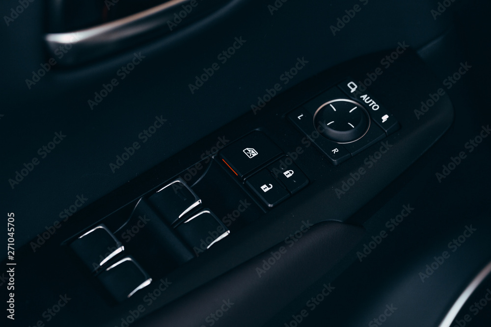 Front and back electric windows buttons-lower or close car windows. Leather upholstery, chrome ornaments. Front and back electric windows buttons-lower or close car windows. Leather upholstery, chrome ornaments.
