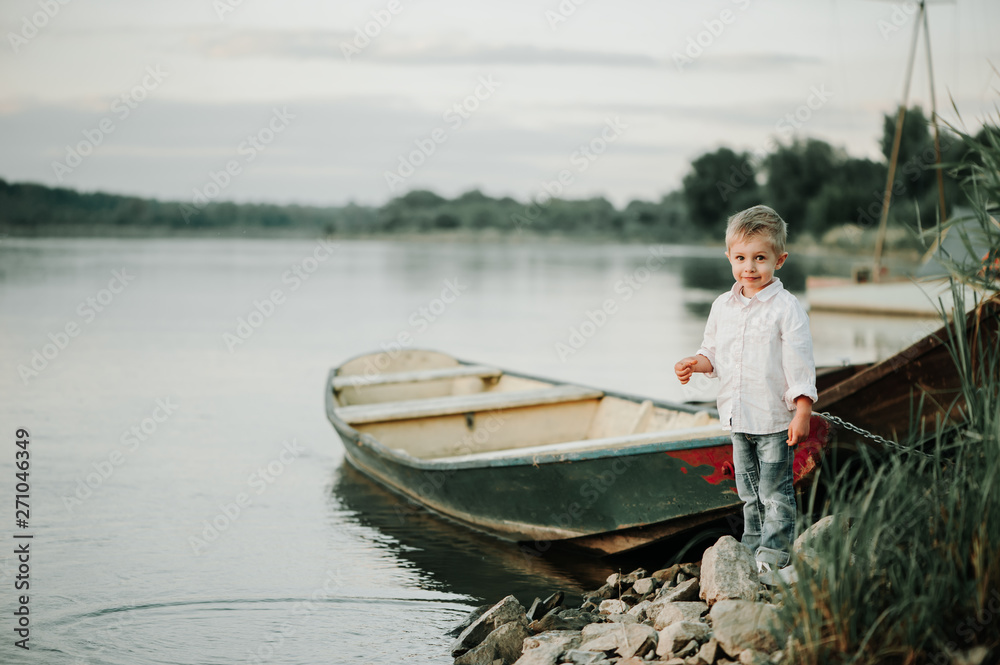 Child on a small boat on the bank of the Vistula River.