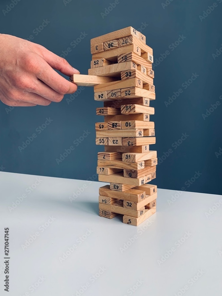 hand with wooden blocks jenga hand with wooden blocks jenga